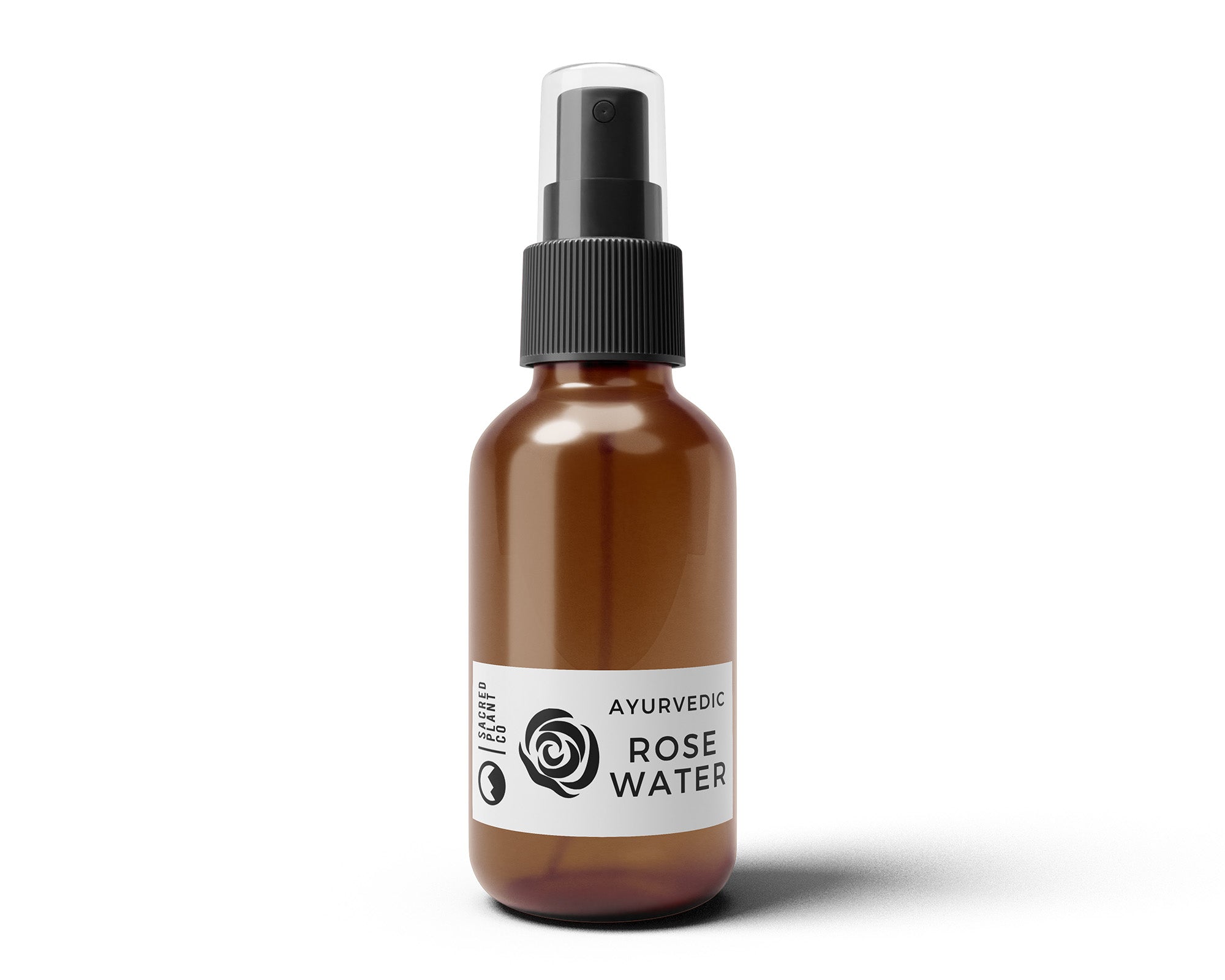 Front-facing view of Sacred Plant Co’s Ayurvedic Rose Water in an amber glass spray bottle with white label and minimalist botanical design.
