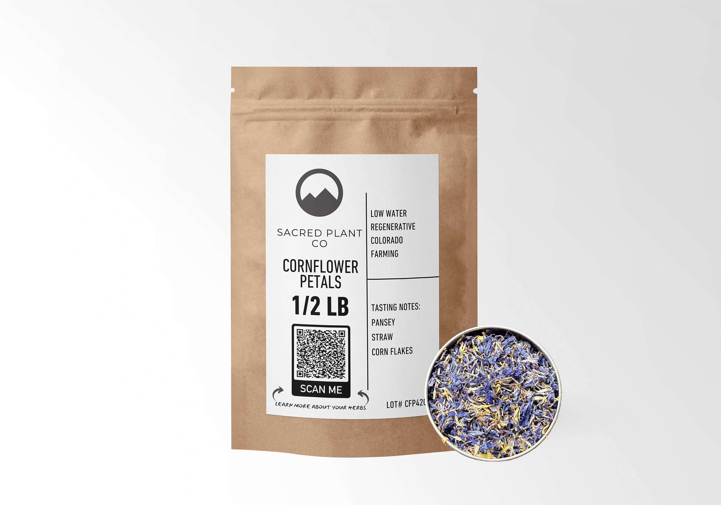 Sacred Plant Co Cornflower Petals 1/2 LB in eco-friendly kraft paper packaging with a sample in a silver tin, used for skin health, promoting digestion, and as a natural dye or garnish.