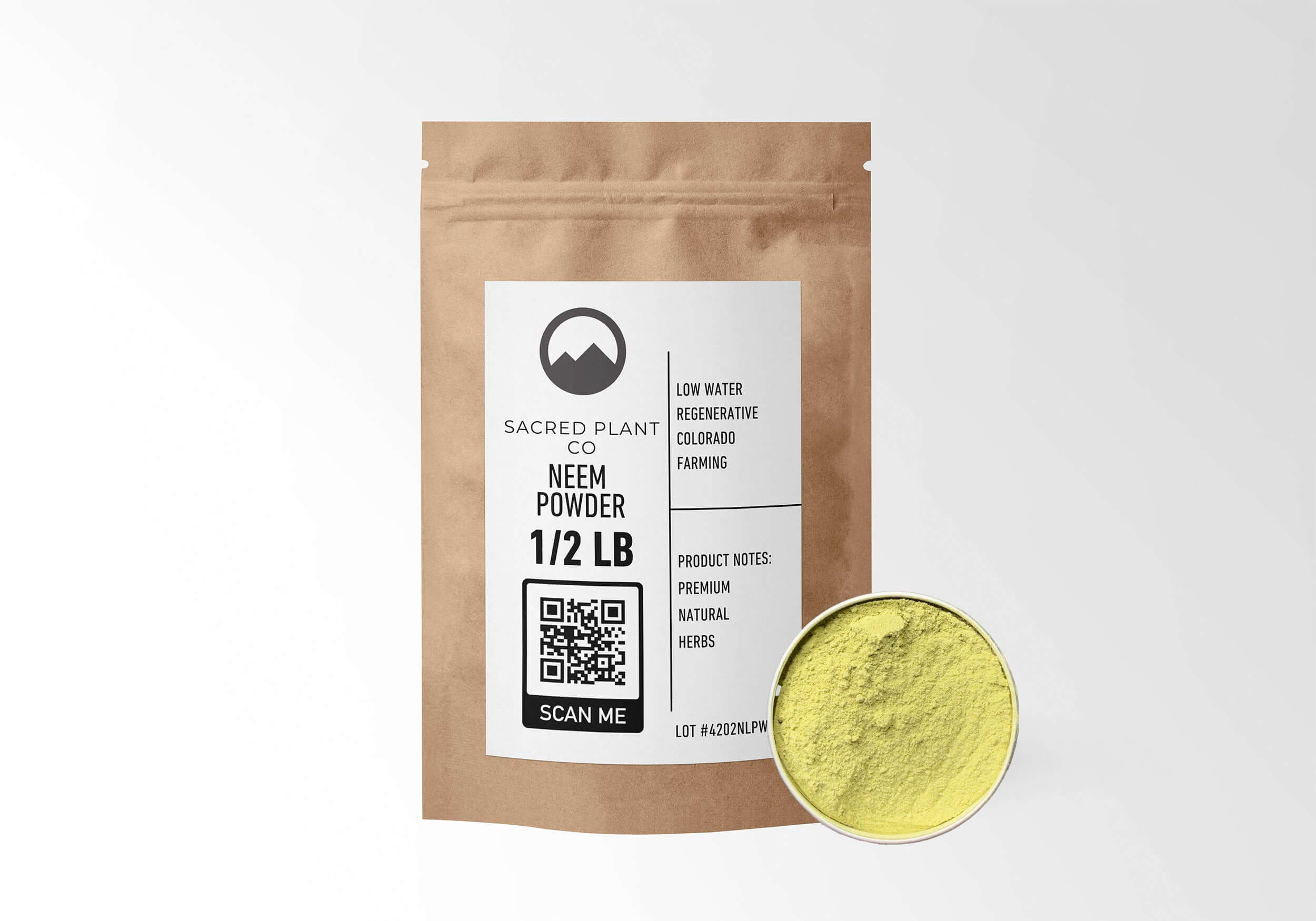 Sacred Plant Co Neem Powder in eco-friendly kraft paper packaging, sample in a silver tin, used as a natural remedy for supporting skin health, promoting oral hygiene, and enhancing immune function.