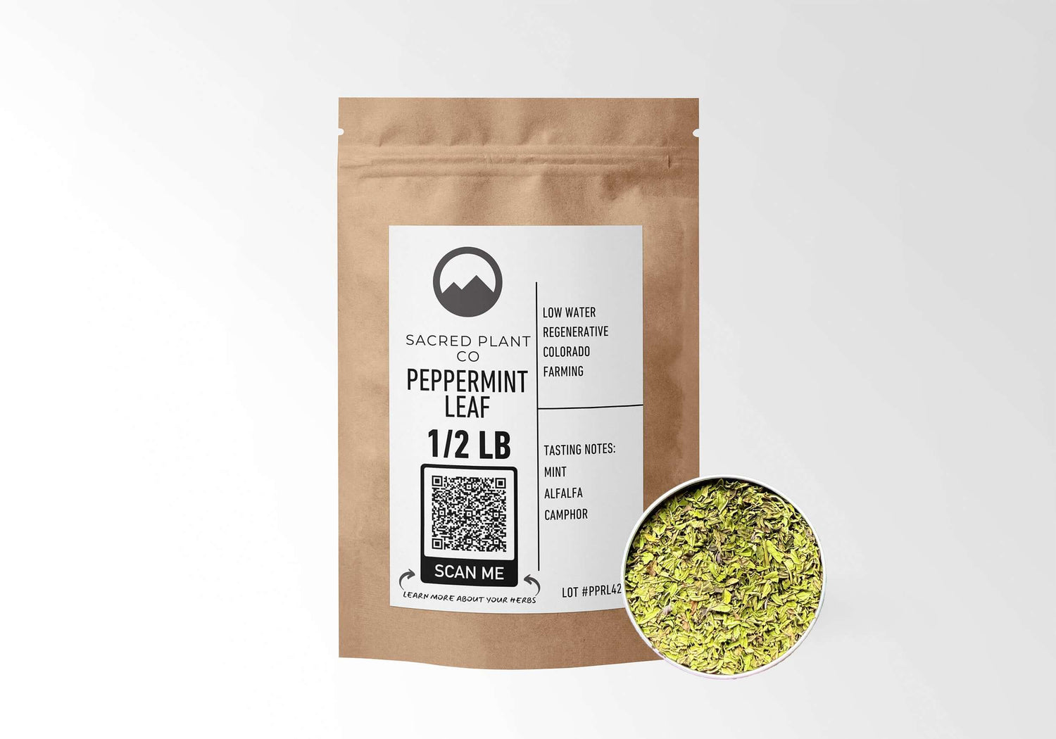 Sacred Plant Co Peppermint Leaf 1/2 LB in eco-friendly kraft paper packaging, showcasing a sample of the herb in a silver tin, great for digestive support and soothing relief.