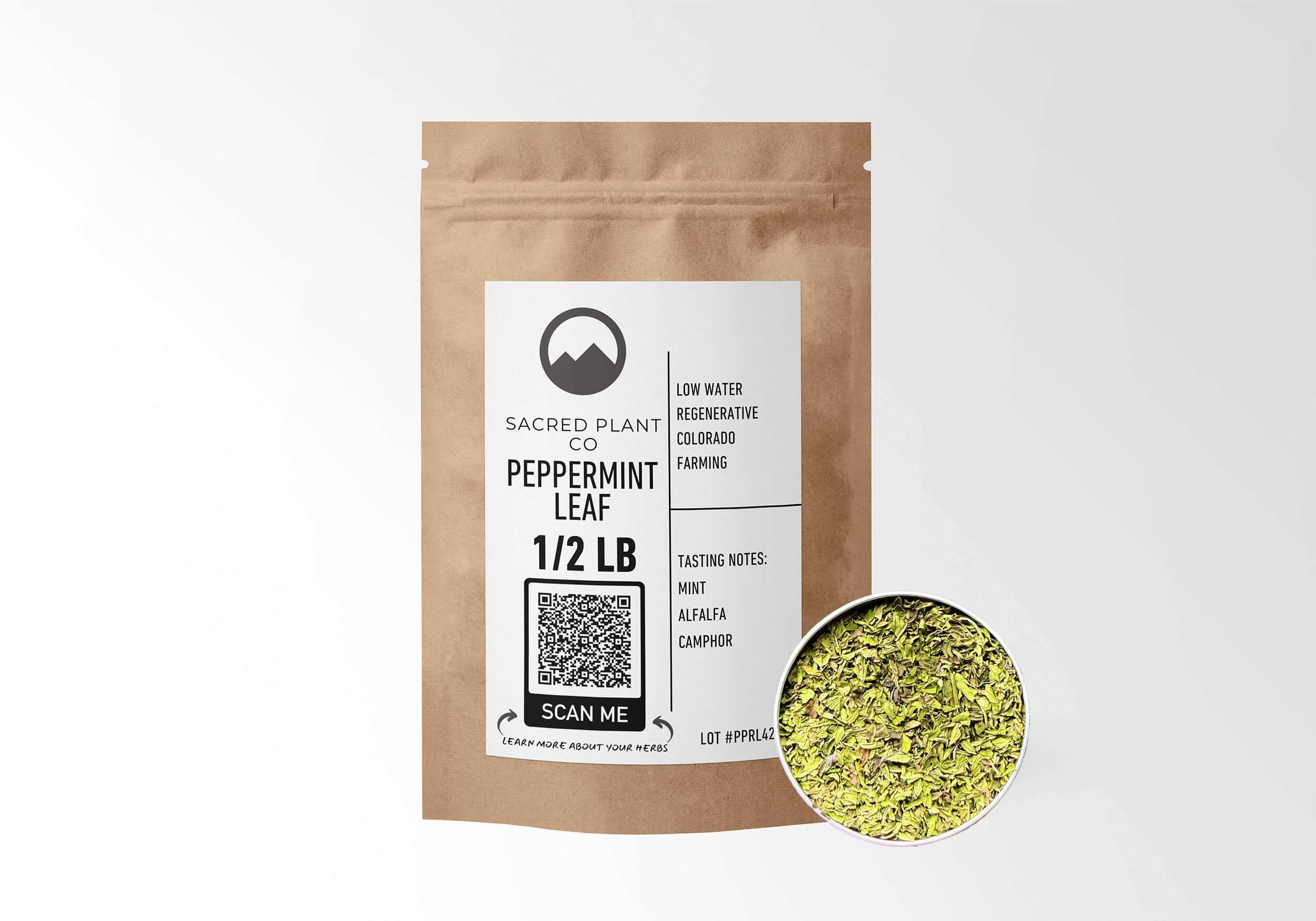 Sacred Plant Co Peppermint Leaf 1/2 LB in eco-friendly kraft paper packaging, showcasing a sample of the herb in a silver tin, great for digestive support and soothing relief.