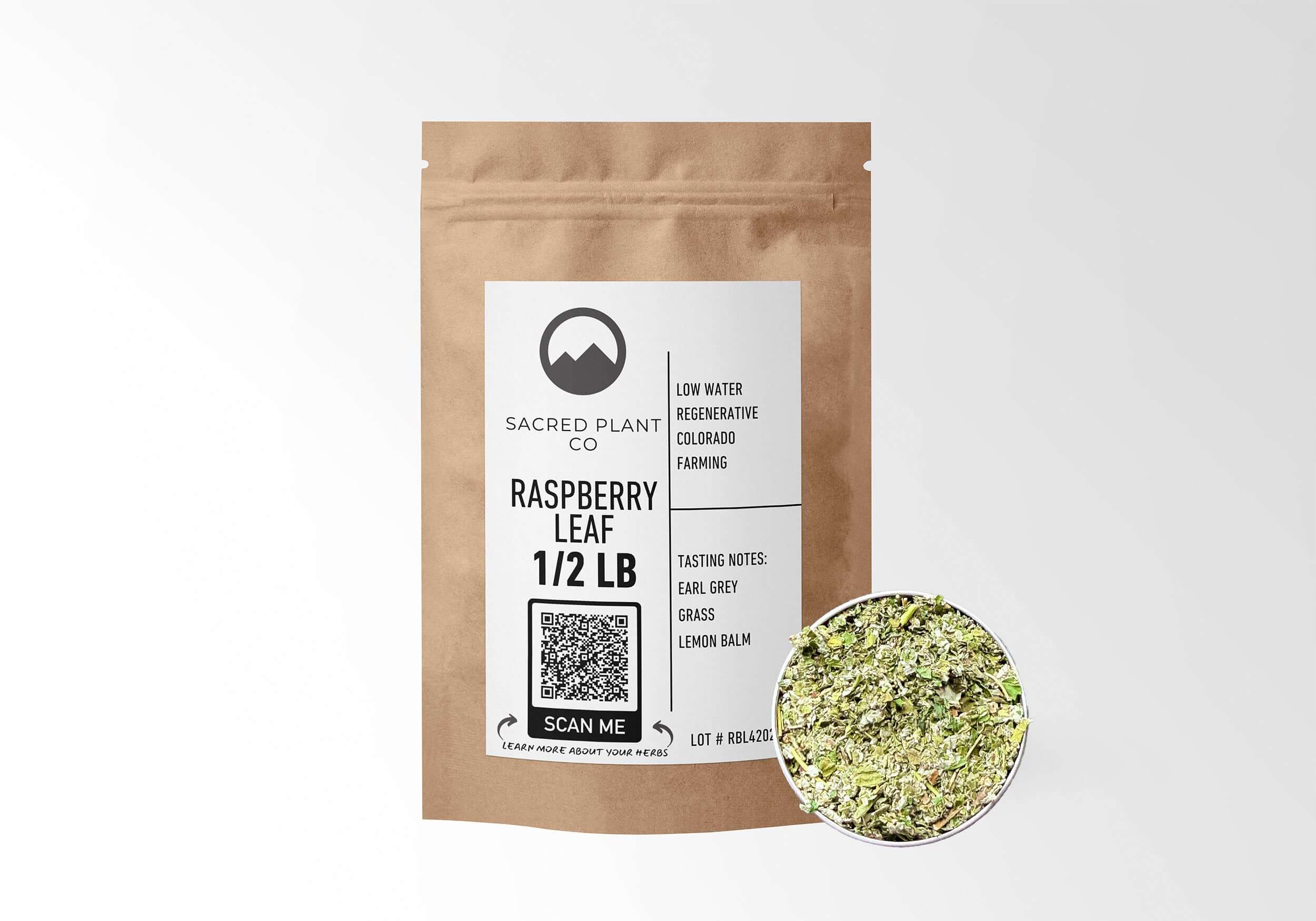 Eco-friendly kraft packaging of Sacred Plant Co Raspberry Leaf 1/2 LB with herb sample in silver tin, sustainably sourced for wellness.
