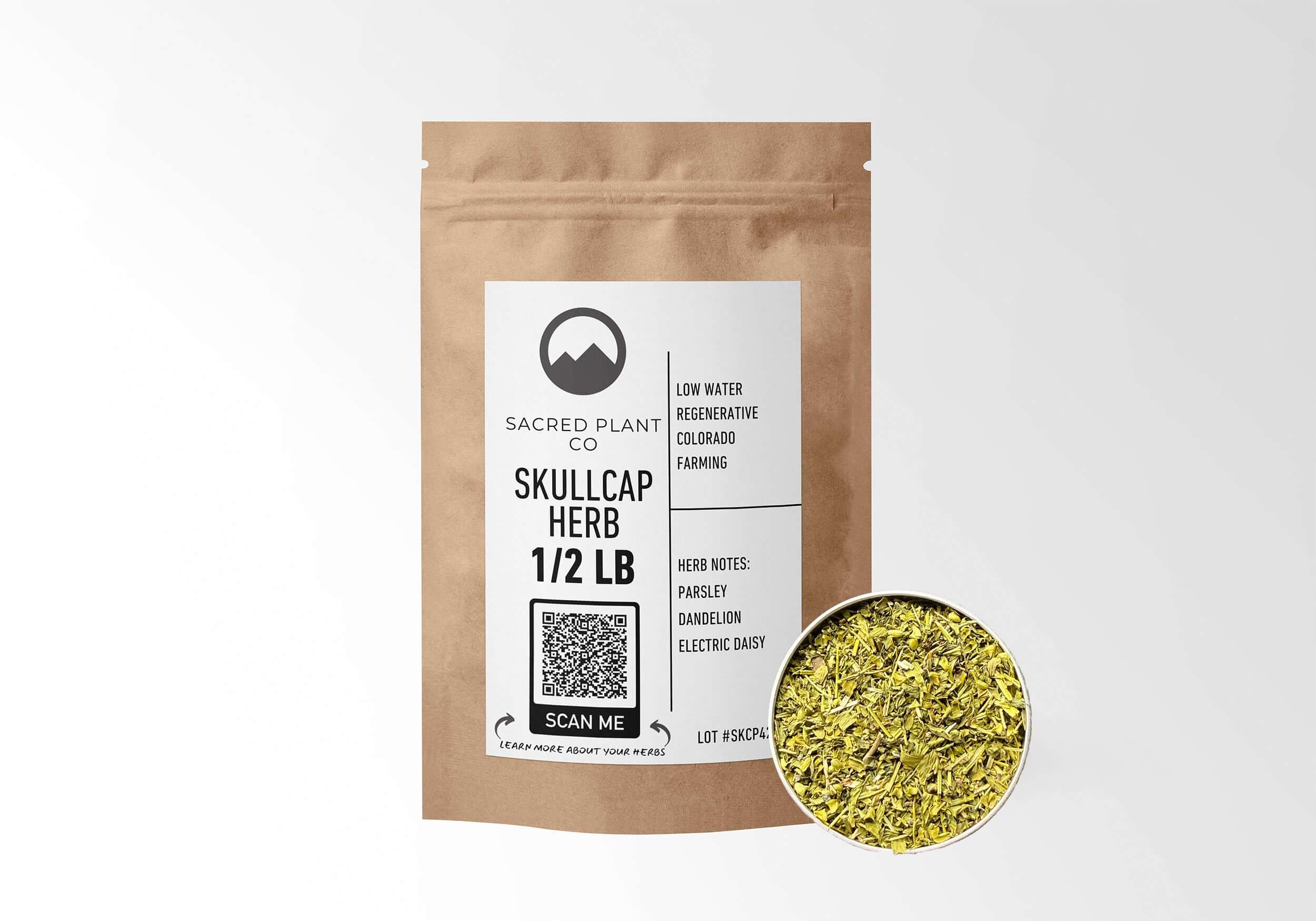 Half pound of Sacred Plant Co Skullcap Herb in eco-friendly kraft paper packaging with a sample in a silver tin, traditionally used for its calming and stress-relieving properties.