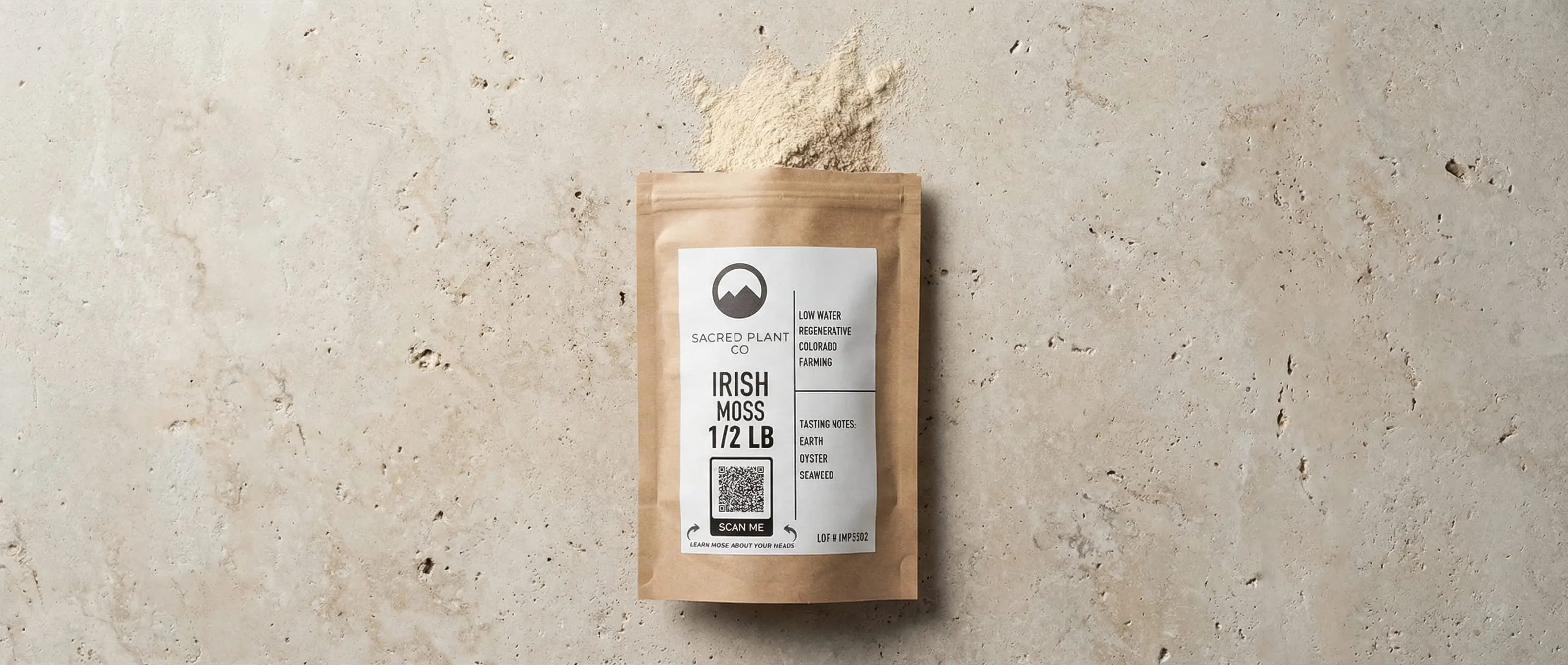 Sacred Plant Co Irish Moss Powder packaging lying flat with a sample of loose powder spilled above it, displaying the earth and seaweed tasting notes.