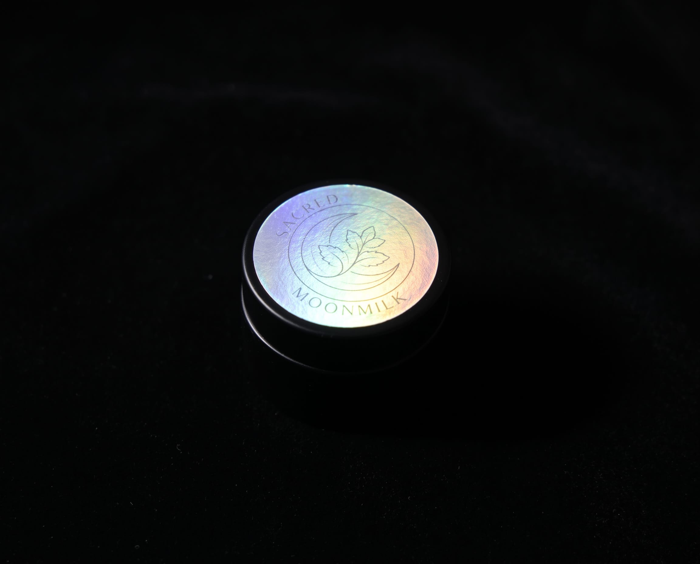 Sacred Plant Co Moonmilk Botanical Night Balm, a handmade mugwort night balm in a matte glass jar