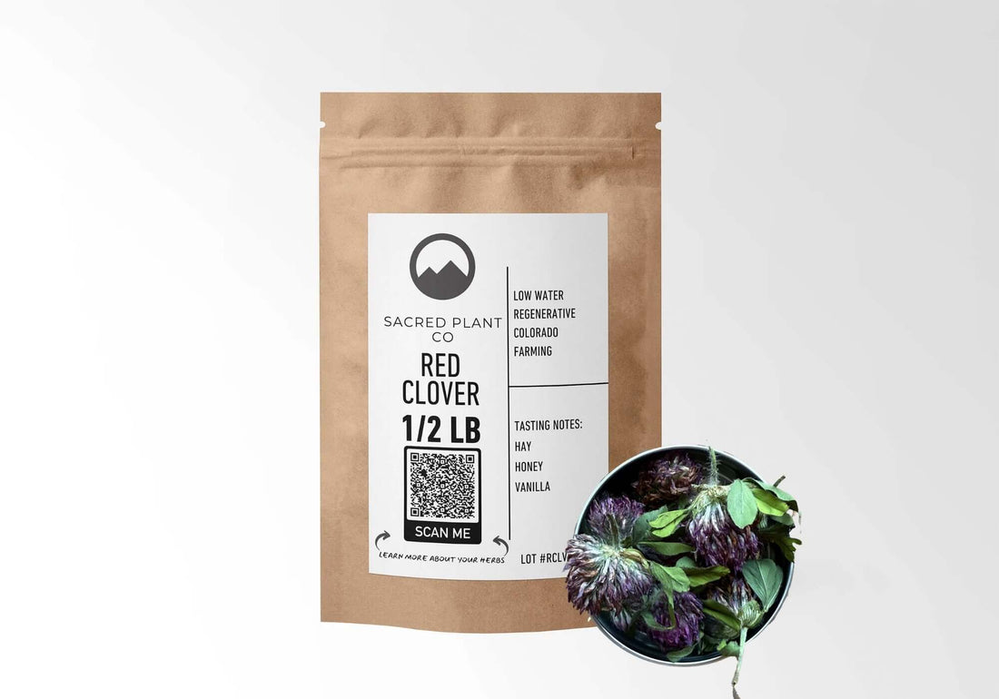 Sacred Plant Co Red Clover 1/2 LB in eco-friendly kraft paper packaging, featuring a sample of herb in a silver tin, highlighting its use for hormone balance and skin health.