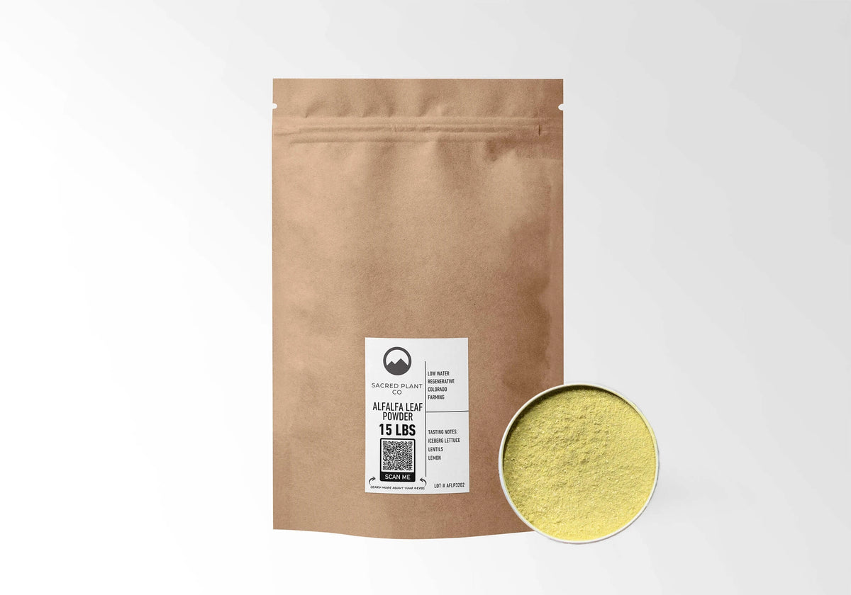Sacred Plant Co Alfalfa Herb Powder 15 LBS kraft stand-up pouch shown with a sample of the herb.