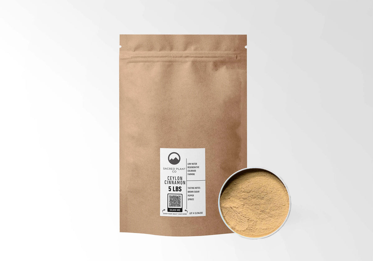 Sacred Plant Co Ceylon Cinnamon 5 LBS kraft stand-up pouch shown with a sample of the powder.