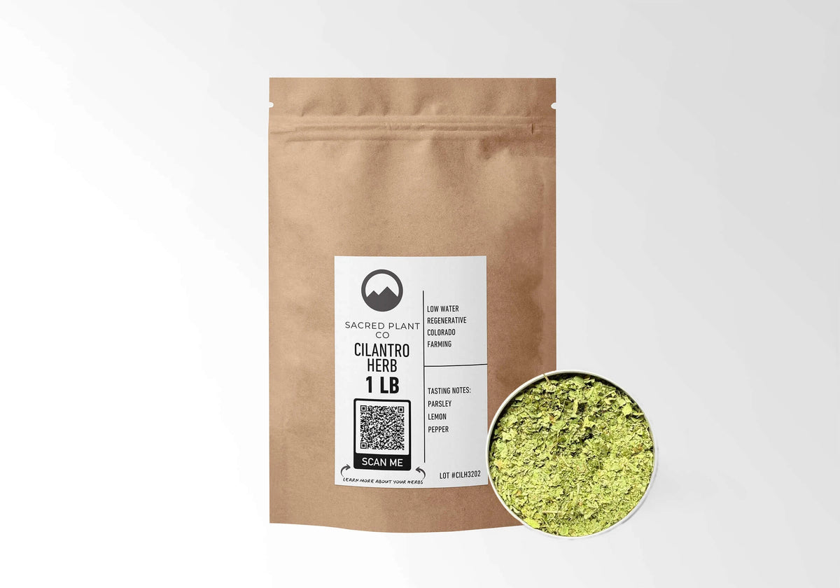 Sacred Plant Co Cilantro Leaf 1 LB kraft stand-up pouch shown with a sample of the herb.