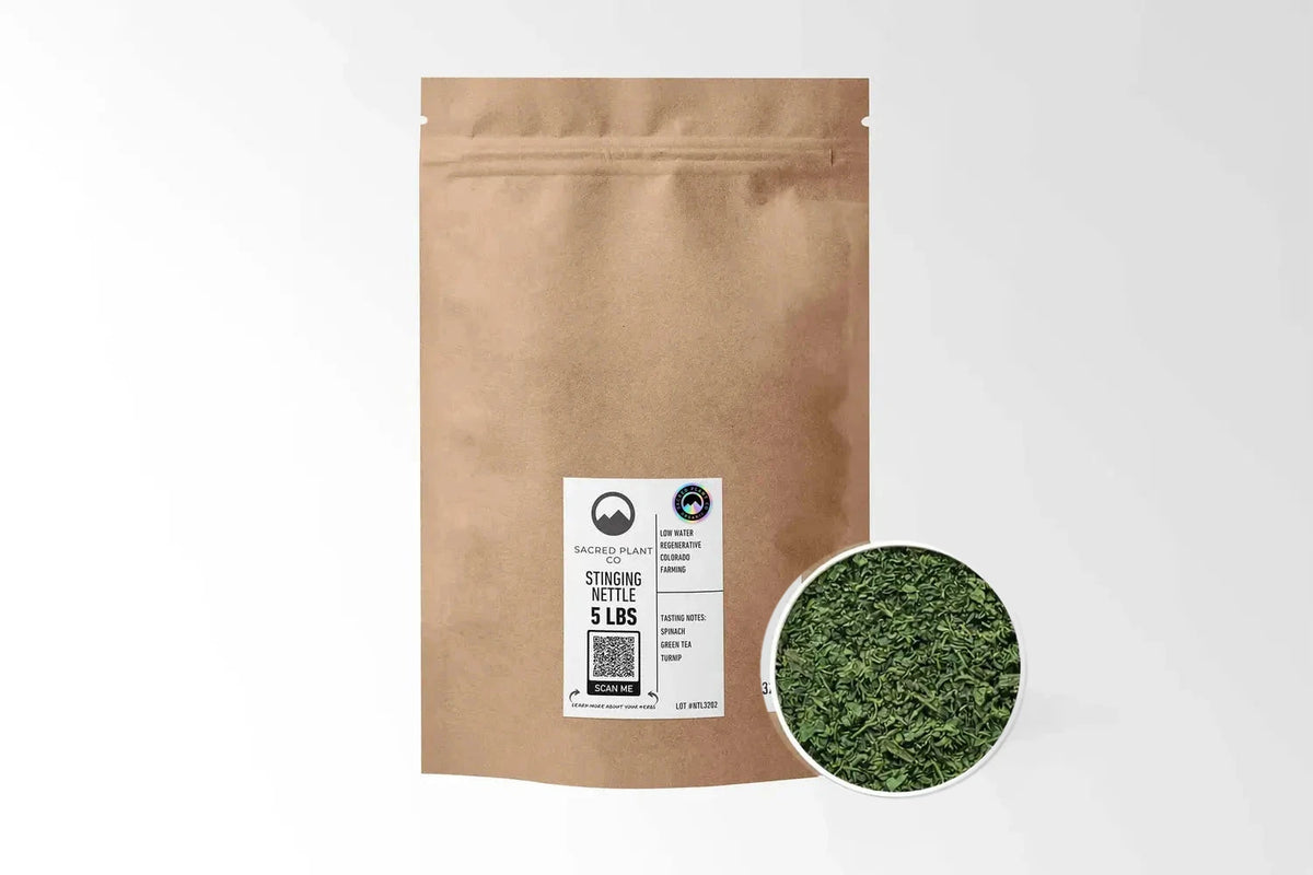 Sacred Plant Co Organic Stinging Nettle Leaf 5 LBS kraft stand-up pouch shown with a sample of the herb.
