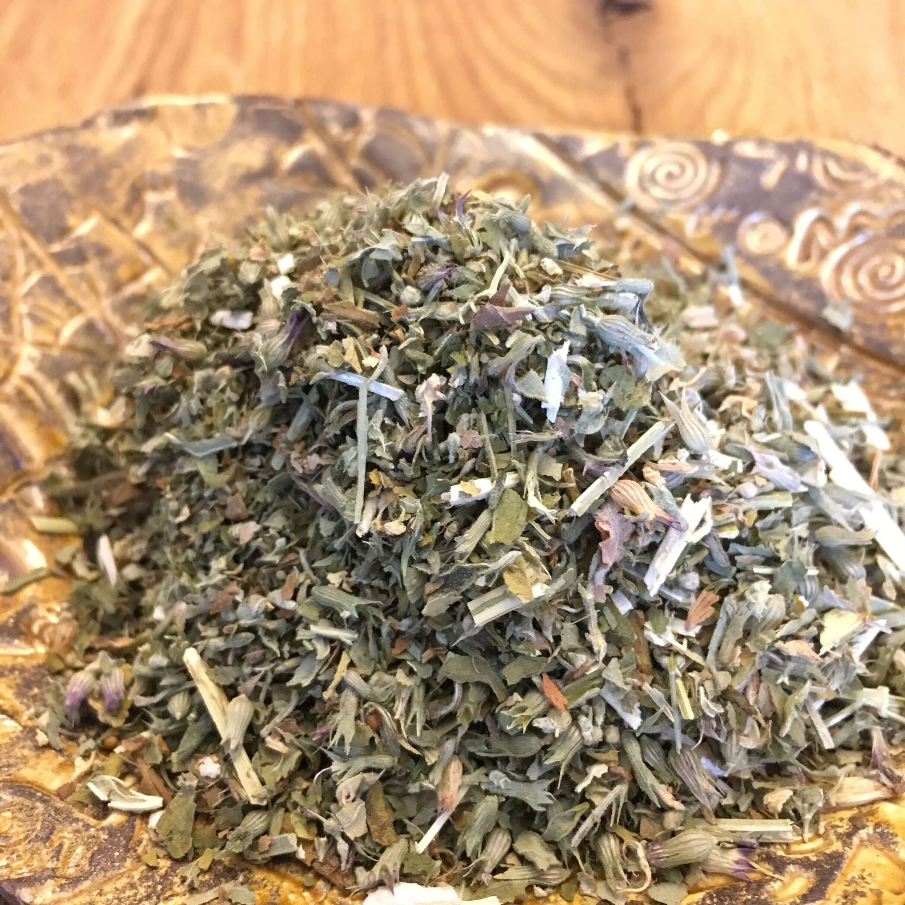 Dried Catnip Herb displayed on a decorative dish with rich green color, emphasizing the premium quality of Sacred Plant Co’s organic herbs.