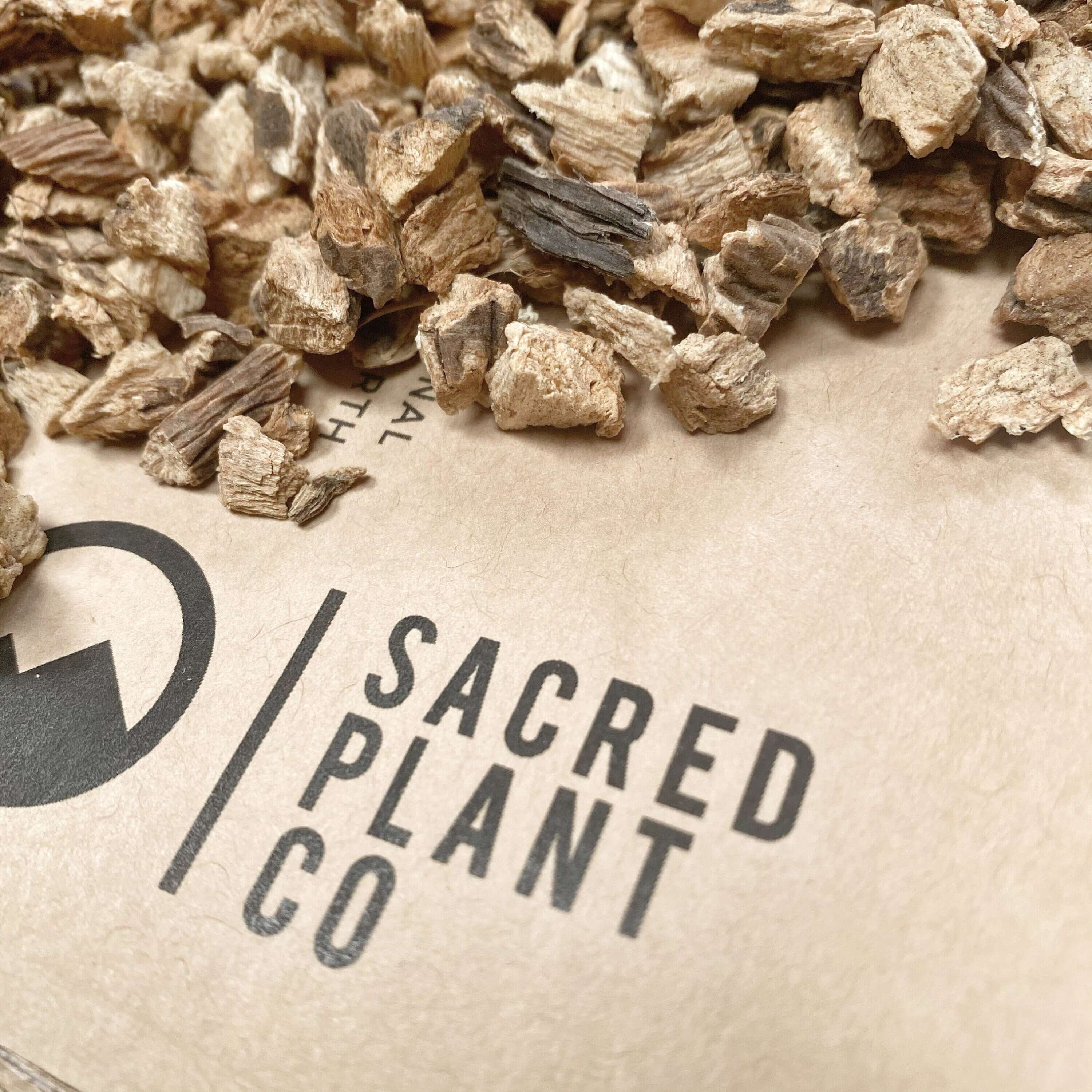 Close-up of Gentian Root pieces by Sacred Plant Co, showcasing premium quality, rough texture, and natural earthy tones.