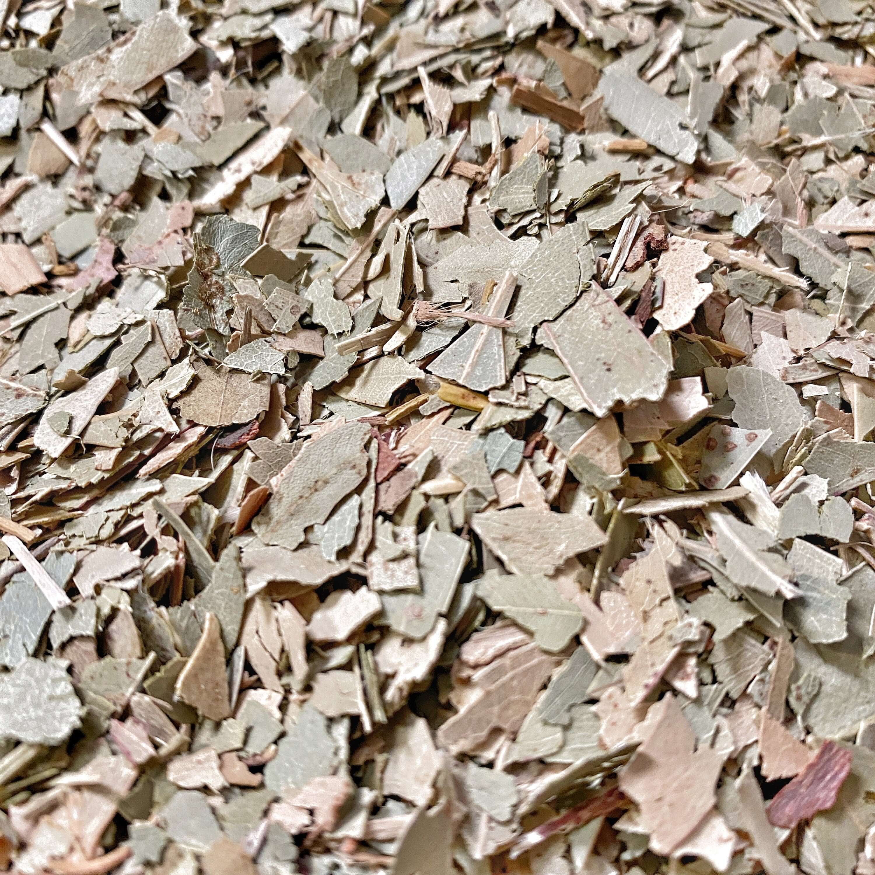 Premium Eucalyptus Leaf pieces from Sacred Plant Co, featuring a mix of light greens and browns, highlighting natural herbal texture.