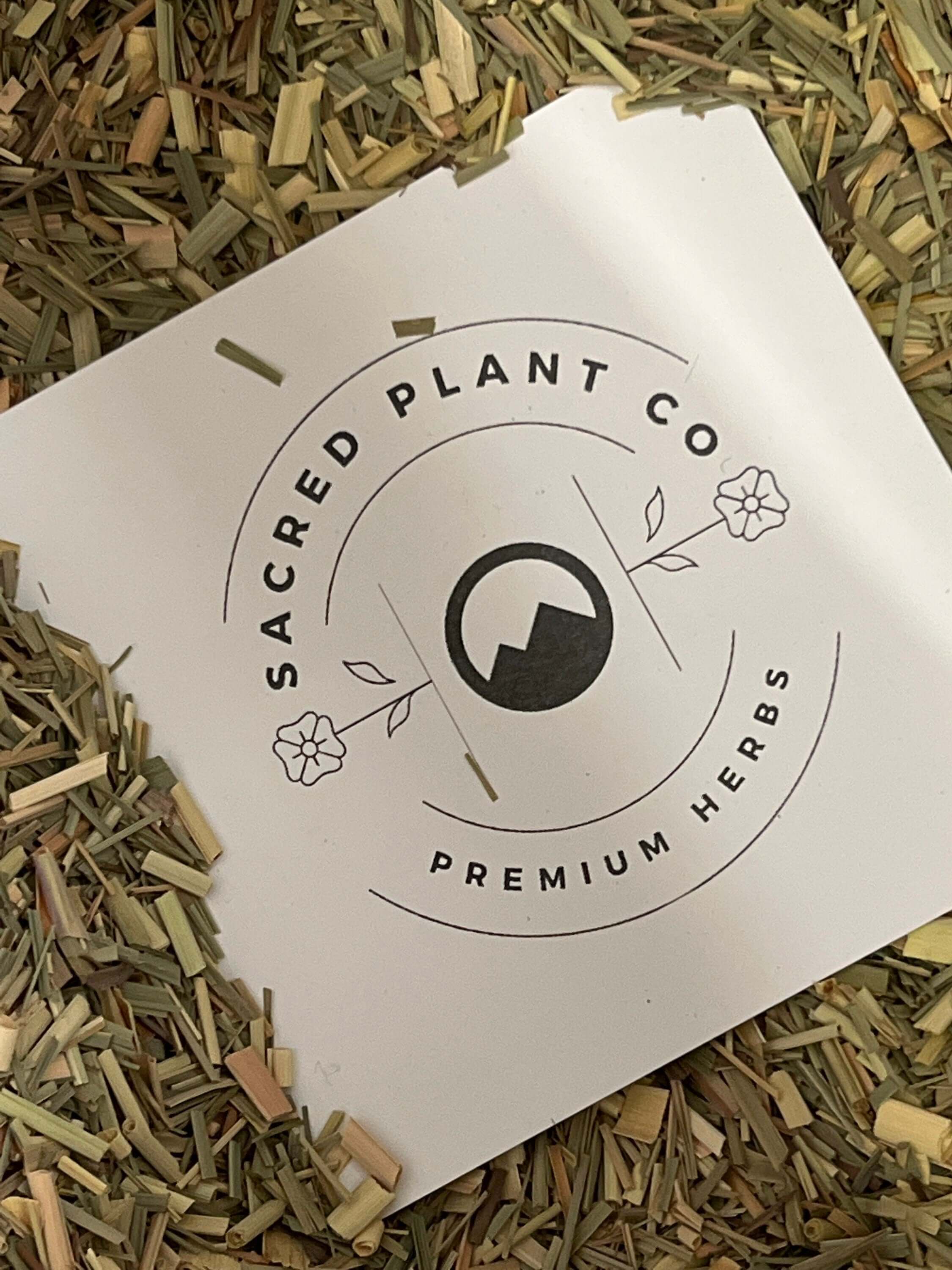 Sacred Plant Co’s high-quality Lemongrass herb, finely chopped with soft texture, surrounding the branded label for a natural display.
