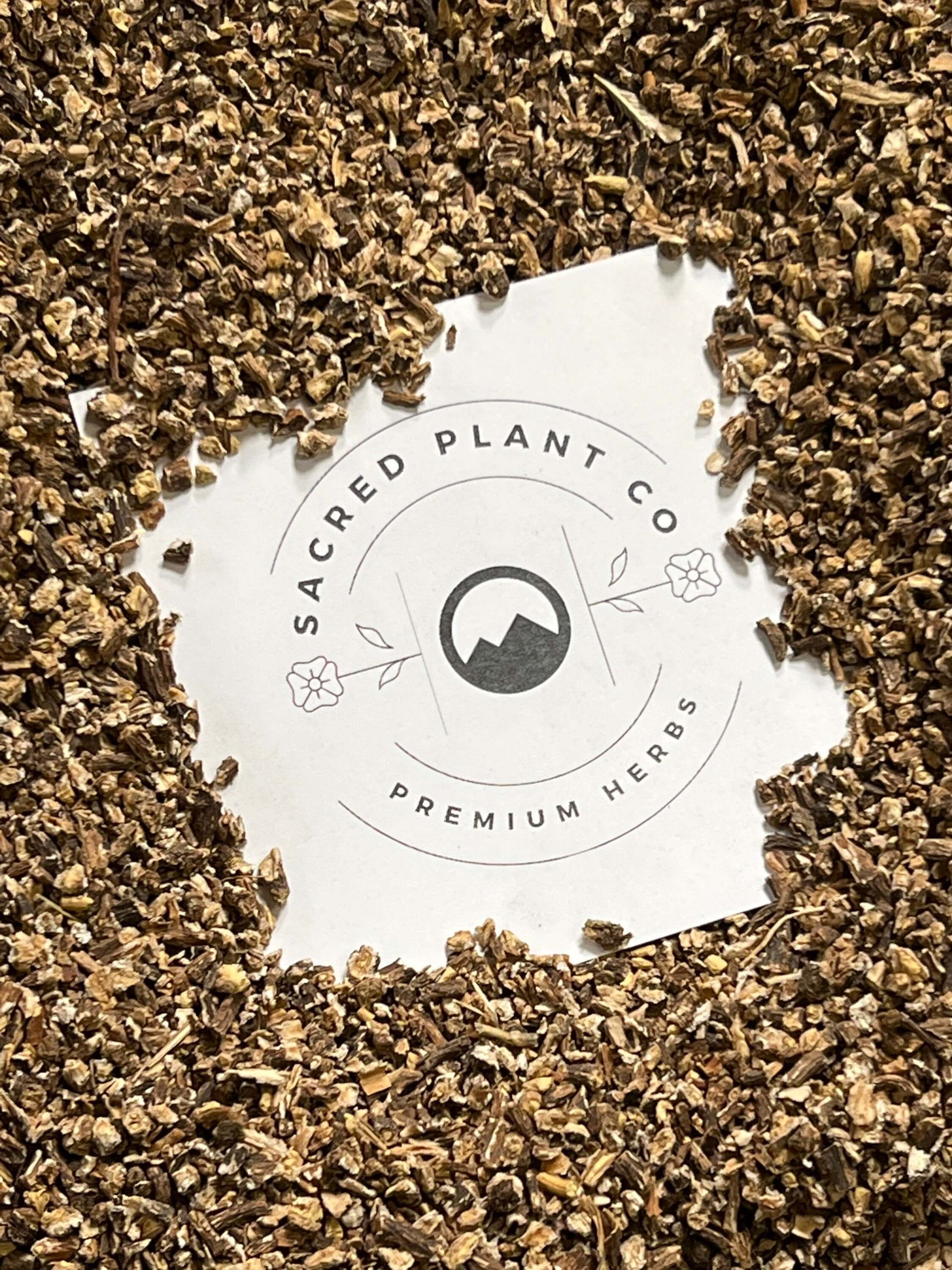 Dried Dandelion Root arranged around Sacred Plant Co logo, highlighting premium quality herbs for natural wellness.