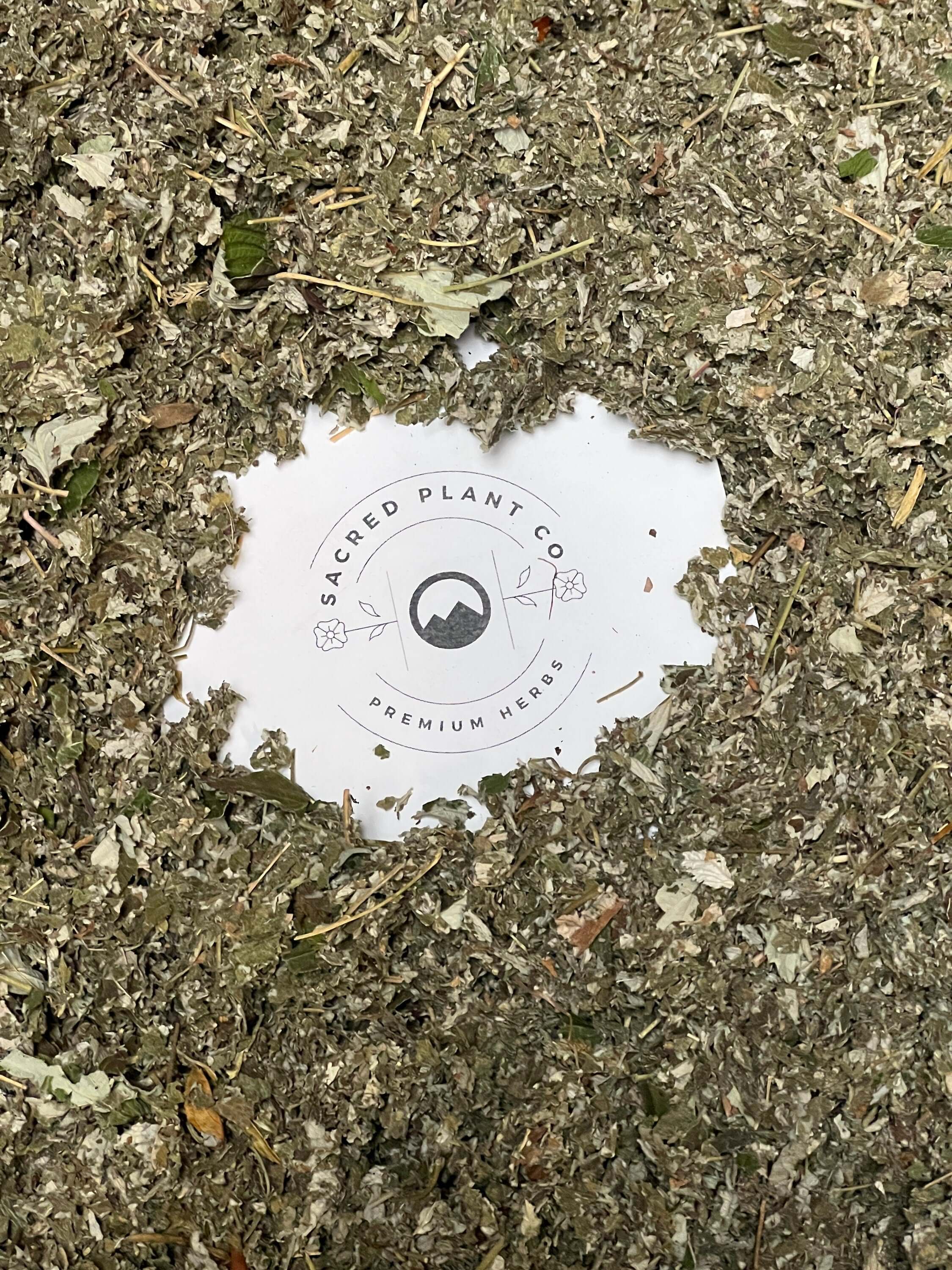 Dried Raspberry Leaf encircles Sacred Plant Co’s logo, underlining the exceptional quality of their premium herbs.