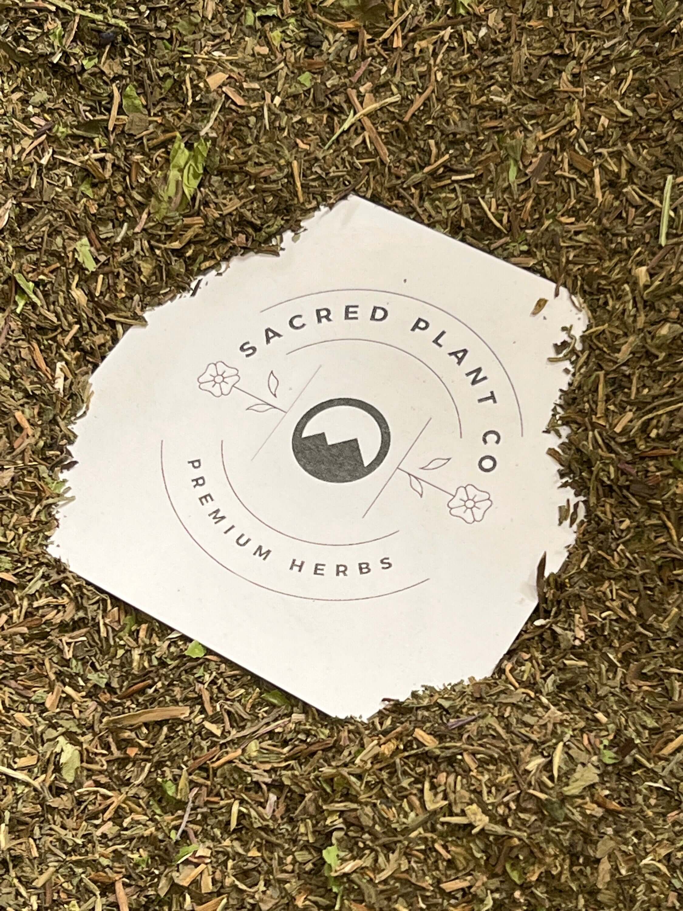 Close-up of Sacred Plant Co’s premium dried Dandelion Leaf, with a rich texture and natural green colors.