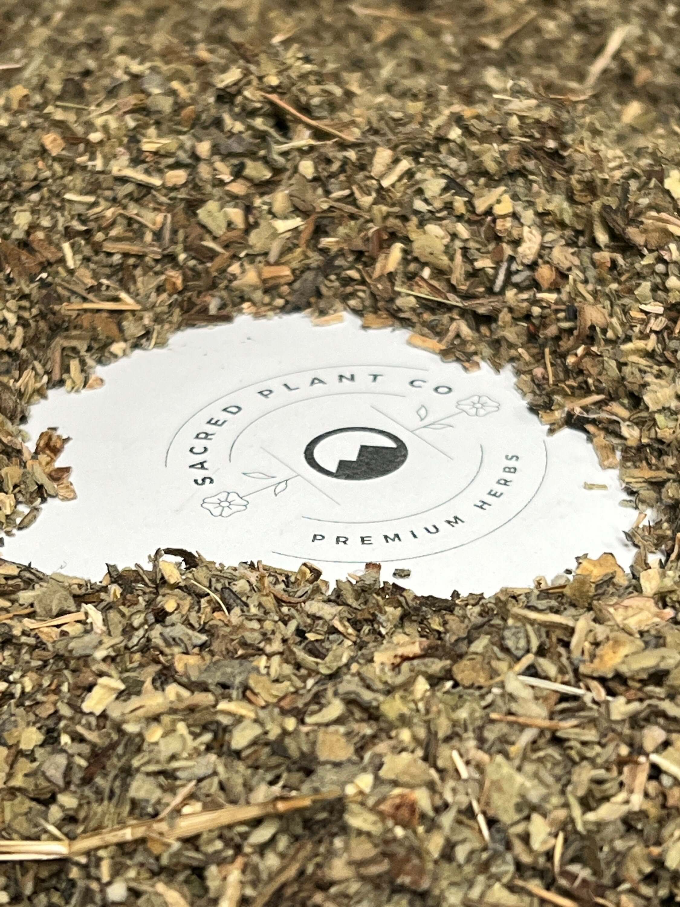 Dried Mullein Leaf with rough, fibrous texture encircling Sacred Plant Co branding, showcasing superior quality herbal products.