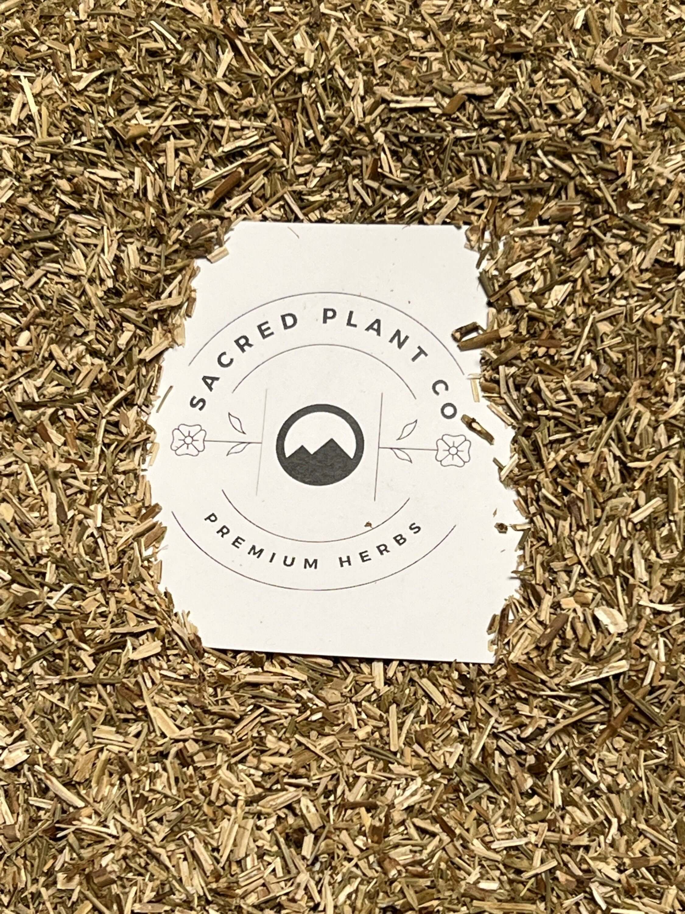 Sacred Plant Co premium Hyssop Herb, finely cut and golden-brown, displayed on a natural beige background with eco-friendly packaging for respiratory and digestive support.