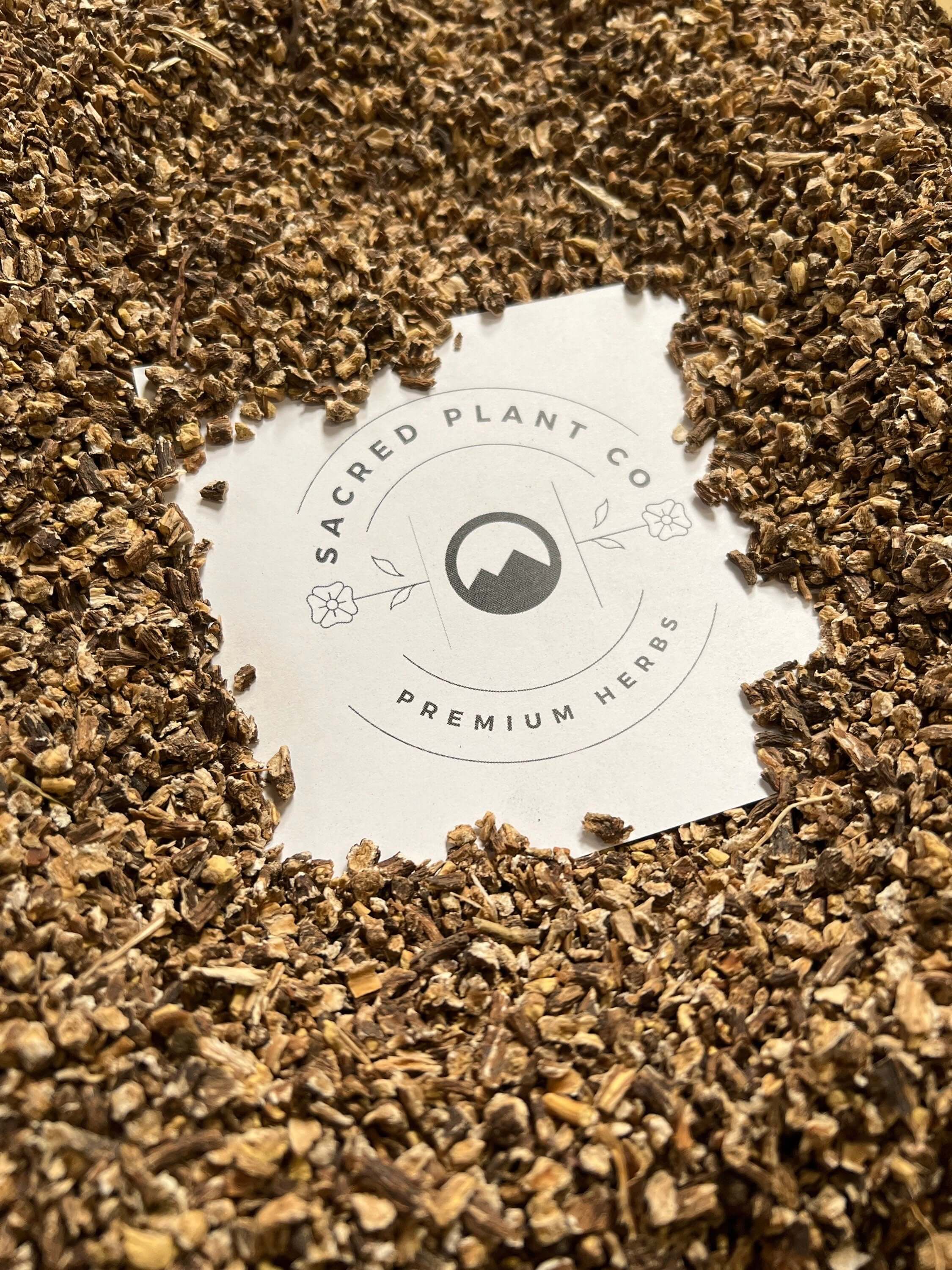 Dried Dandelion Root surrounding Sacred Plant Co logo, highlighting premium herbs and natural health products.