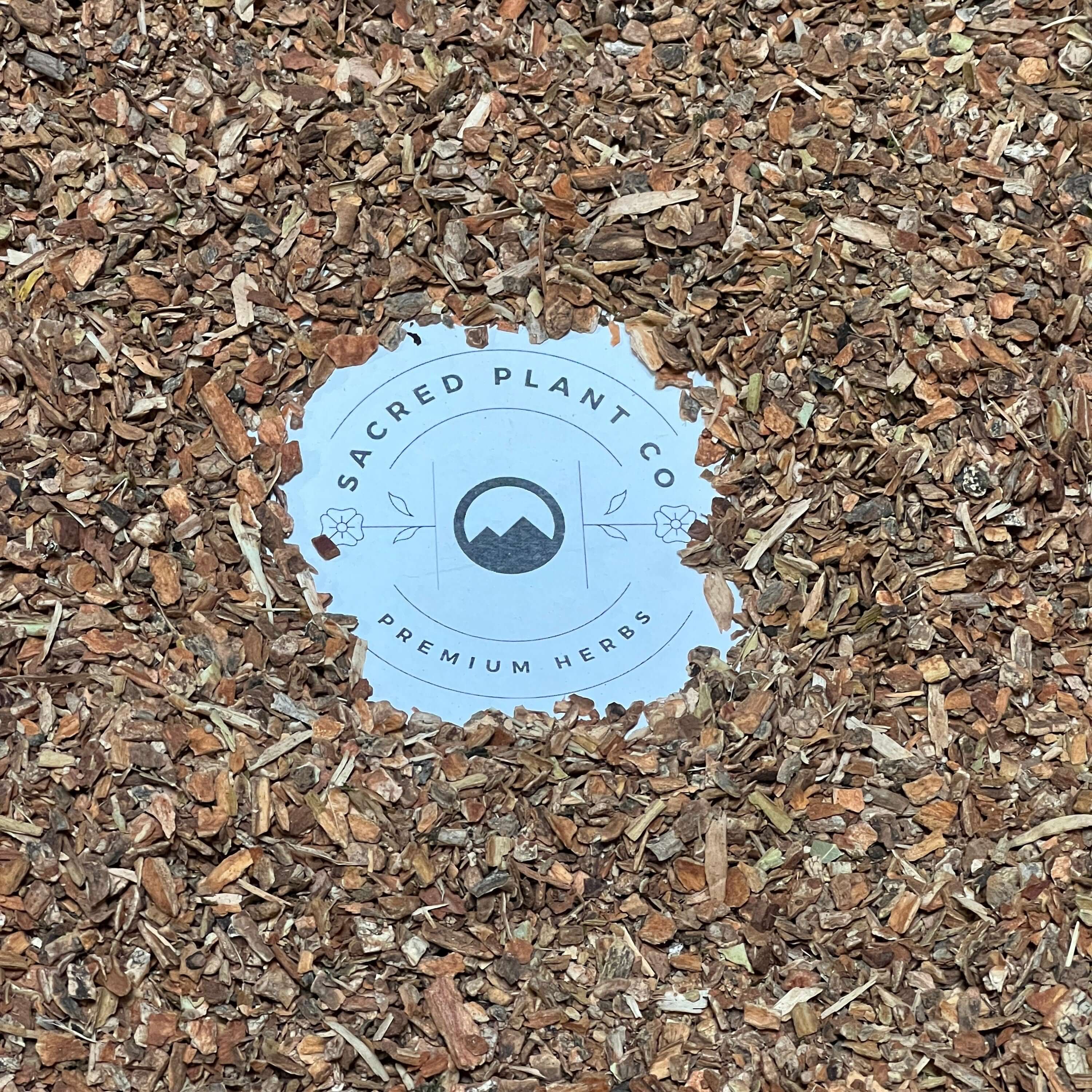 Rich, organic Cramp Bark with earthy textures surrounding Sacred Plant Co’s logo, emphasizing its premium herbal quality.