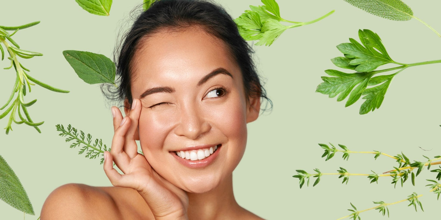 This vibrant image highlights the theme of natural beauty and skincare, showcasing a radiant woman surrounded by fresh herbs like parsley, thyme, and mint against a soft green background.