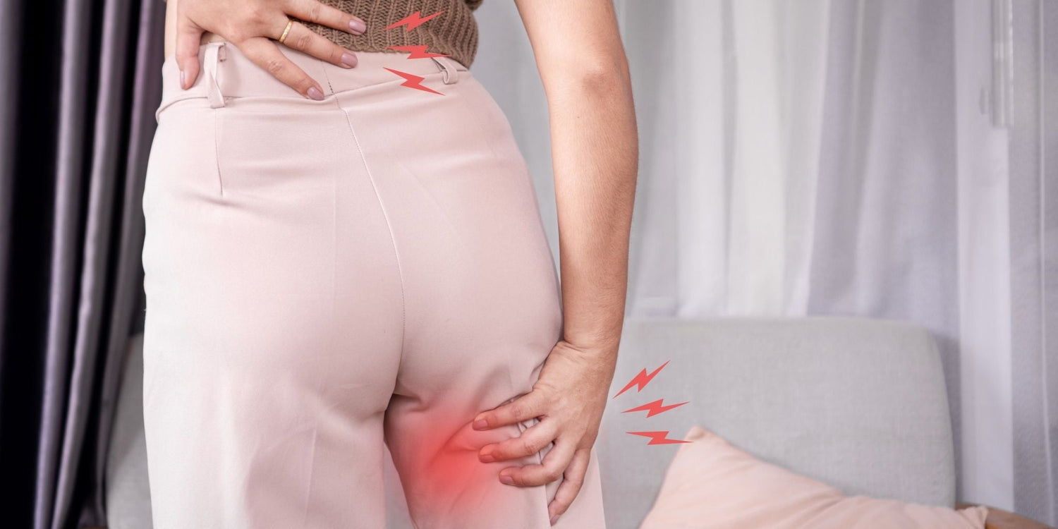 A person experiencing sciatica pain, indicated by highlighted red areas and sharp pain symbols on the lower back and thigh, showcasing the discomfort commonly associated with the condition.