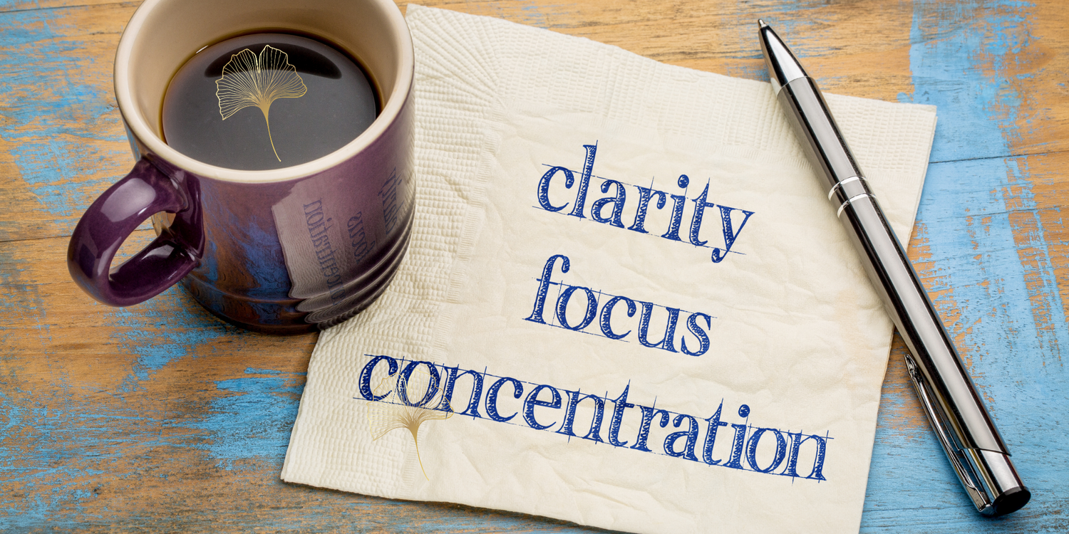 Cup of Coffee with the words Clarity, Focus, Concentration on a note