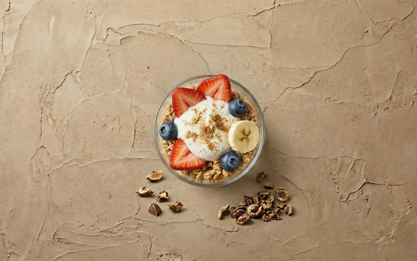 finished immune-boosting yogurt parfait dusted with Amla powder, surrounded by dried Indian Gooseberry pieces.