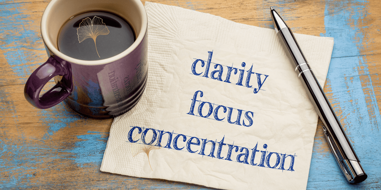 Cup of Coffee with the words Clarity, Focus, Concentration on a note