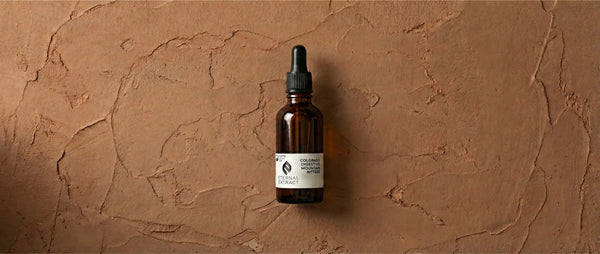 Product shot of Sacred Plant Co digestive bitters, featuring a dropper cap and labeling for wild mountain ingredients.