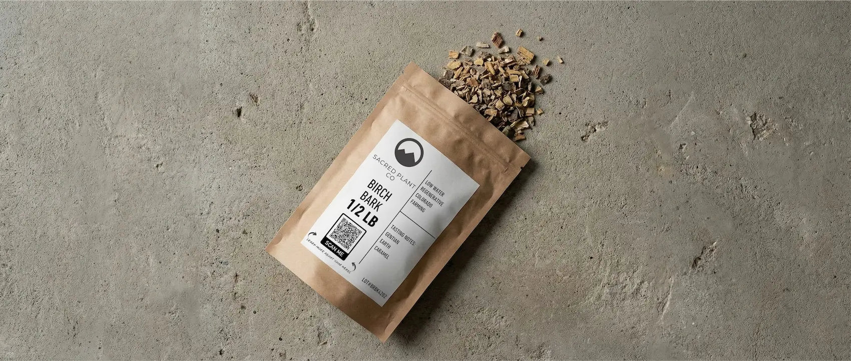 Sacred Plant Co bulk dried birch bark packaging showing QR code and tasting notes of gentian, earth, and caramel.