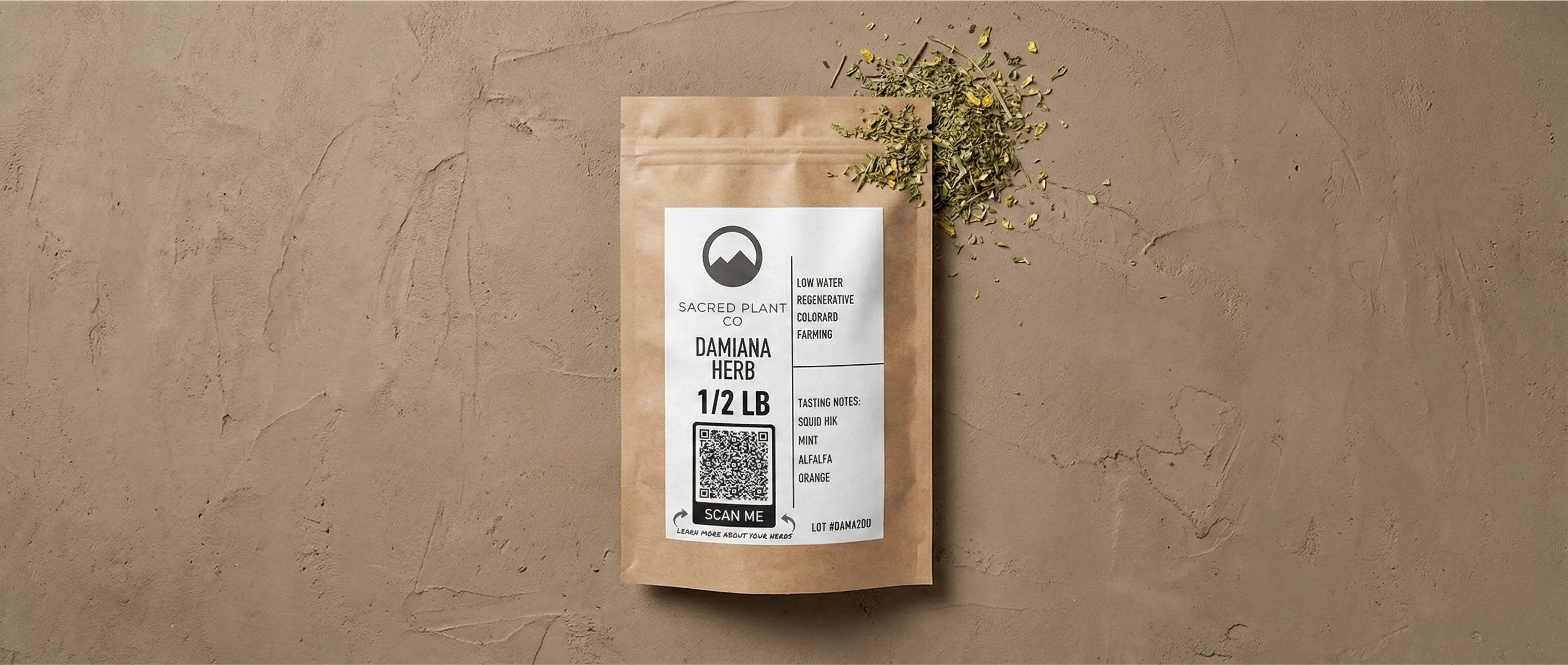 A 1/2 lb bag of Sacred Plant Co Damiana Herb lying flat next to a pile of green, cut-and-sifted dried leaves.