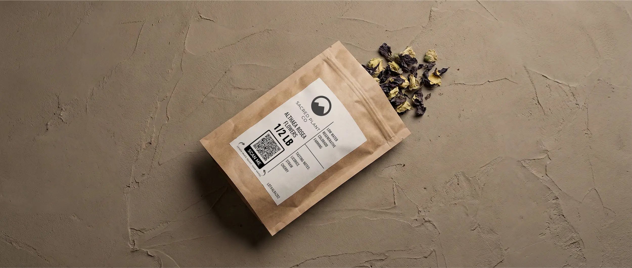 High-quality dried violet hollyhock blossoms rich in anthocyanins and mucilage, displayed next to regenerative farming packaging.