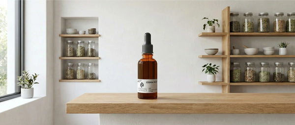 Sacred Plant Co herbal tincture bottle on a wooden counter, illustrating the daily administration of plant medicine in a home setting.