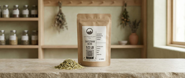 Dried oatstraw herb beside a Sacred Plant Co kraft bag, showcasing the silica-rich foundation used in strengthening hair growth tonics.