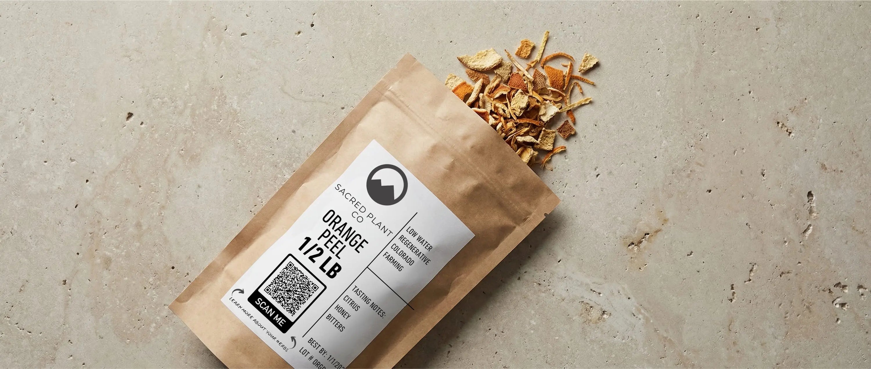 Organic orange peel layflat showing Sacred Plant Co bag. 