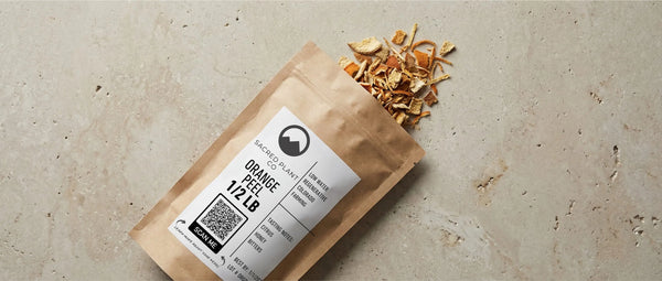 Organic orange peel layflat showing Sacred Plant Co bag. 
