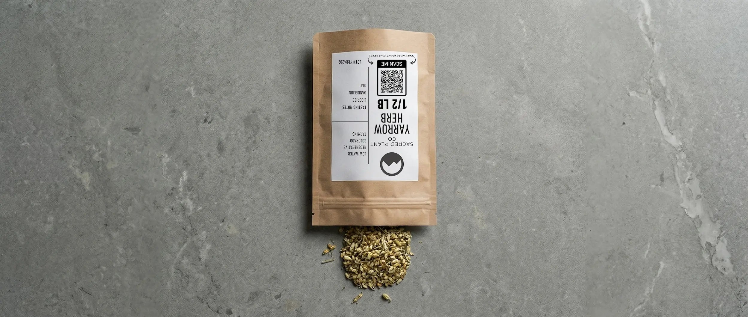 Dried, coarsely chopped yarrow flowers spill from a Sacred Plant Co kraft bag, showcasing regeneratively cultivated herbs for wound healing.