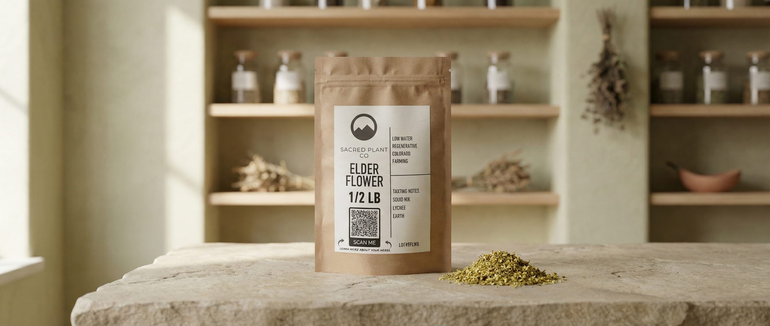 Sacred Plant Co elderflower (Sambucus nigra) 1/2 lb kraft bag on a stone counter in a minimalist apothecary setting