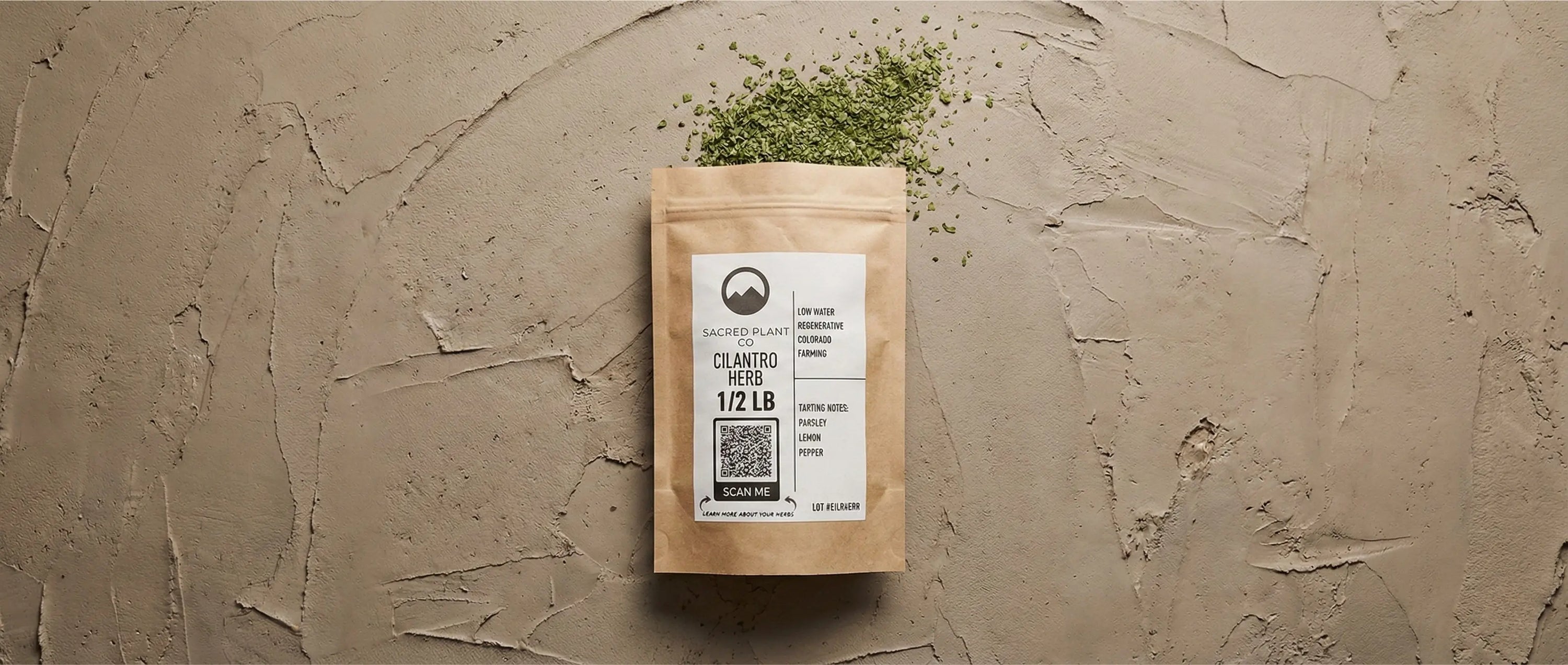 1/2 lb bag of organic cut and sifted cilantro leaf on a textured background, displaying Sacred Plant Co branding.