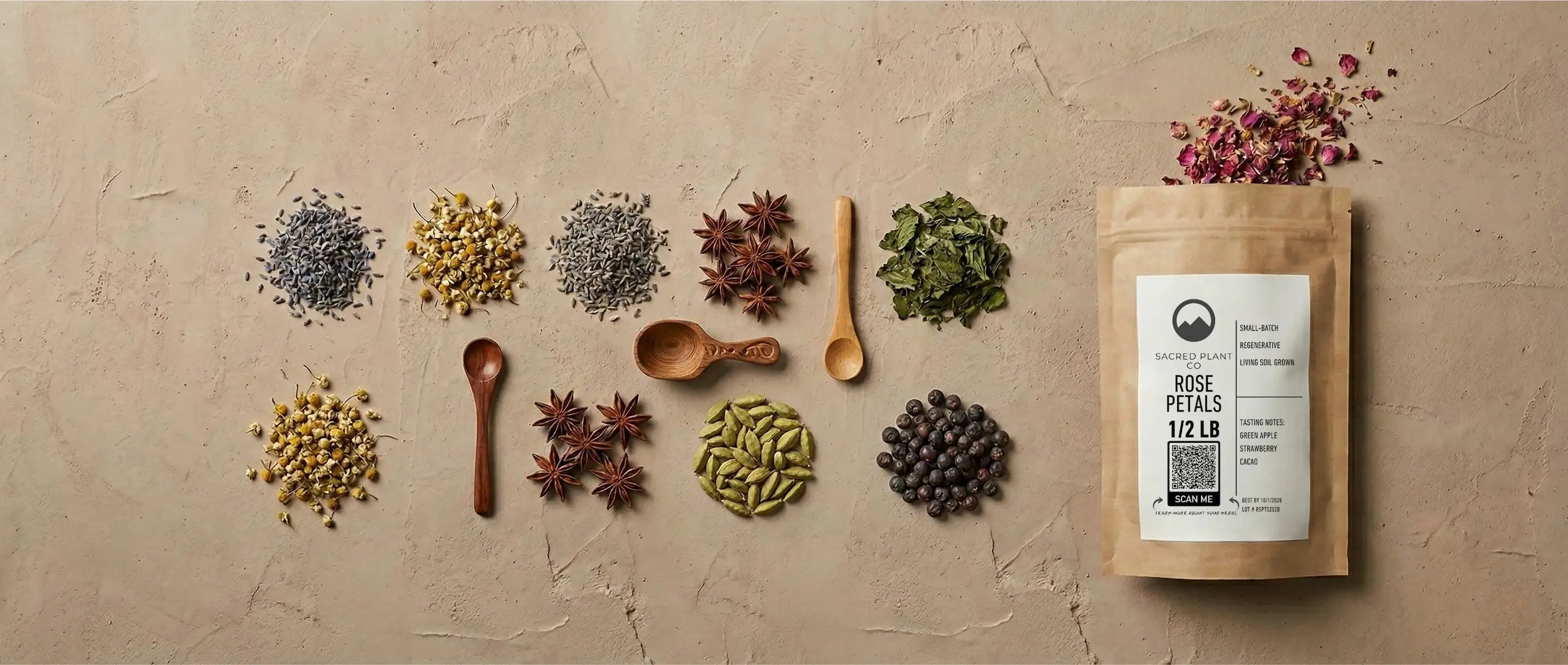An assortment of organic dried herbs and botanicals displayed with wooden scoops and a brown kraft paper bag for wholesale bulk ordering.