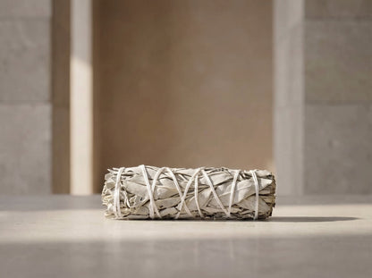 Single 4-inch white sage smudge stick, minimalist product photo
