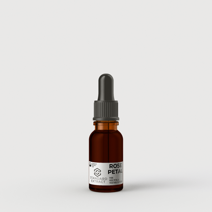 15ml amber glass bottle with black dropper of standard rose petal extract on a grey background, with a simple and elegant product label design