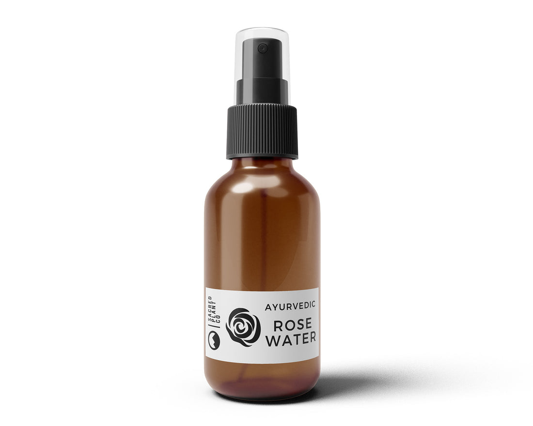 Front-facing view of Sacred Plant Co’s Ayurvedic Rose Water in an amber glass spray bottle with white label and minimalist botanical design.