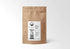 Sustainably packaged 1 LB kraft paper bag of Angelica Root from Sacred Plant Co, offering premium herbal support for digestive and respiratory health.