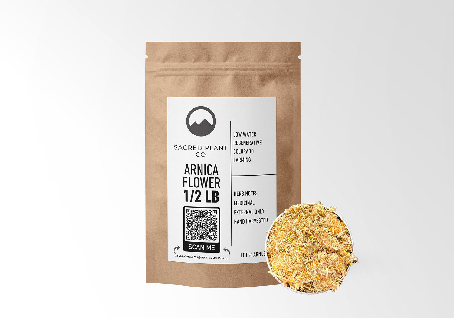 Sacred Plant Co Arnica Flower 1/2 LB in eco-friendly kraft paper packaging, featuring a sample of herb in a silver tin, for external medicinal use and pain relief.