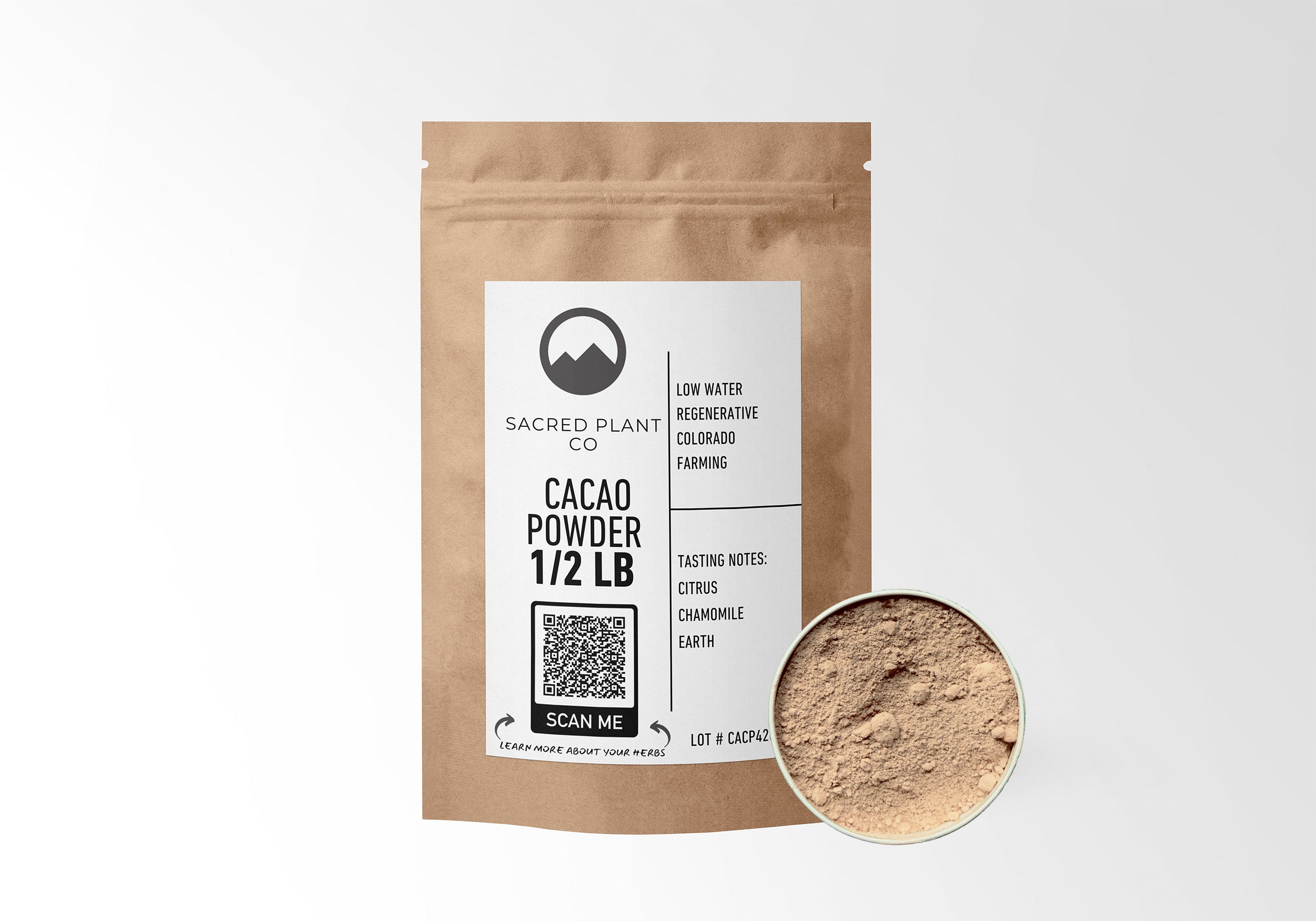 Sacred Plant Co Cacao Powder in eco-friendly kraft paper packaging, sample in a silver tin, often used for its antioxidant properties and mood-enhancing benefits.