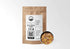 Sacred Plant Co Chili Pepper Flakes 1/2 LB in eco-friendly kraft paper packaging, with a sample in a silver tin. Used for adding spice to dishes, enhancing metabolism, and supporting digestion.