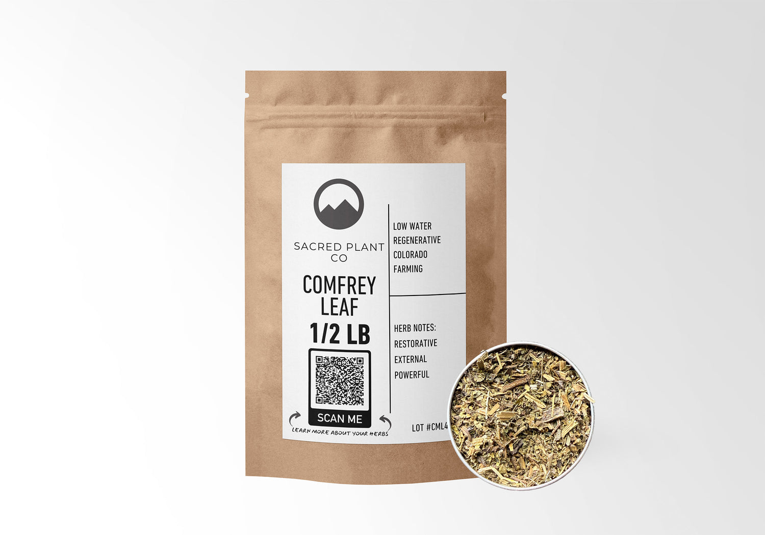 Sacred Plant Co Comfrey Leaf 1/2 LB in kraft paper packaging with sample in a silver tin, emphasizing the use of Comfrey Leaf for natural health remedies.